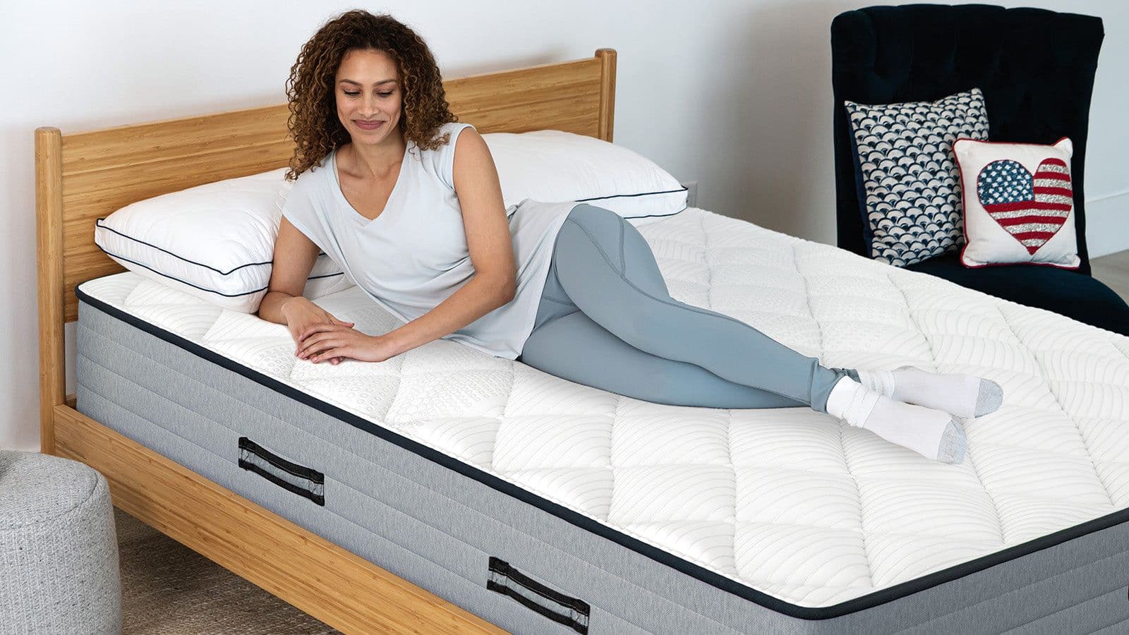 Mattress in a styled bedroom showing how firmness affects comfort