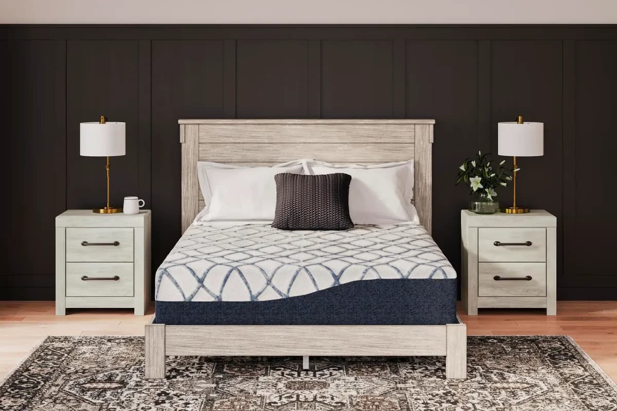 Ashley Sleep mattress with white bedding in a modern bedroom