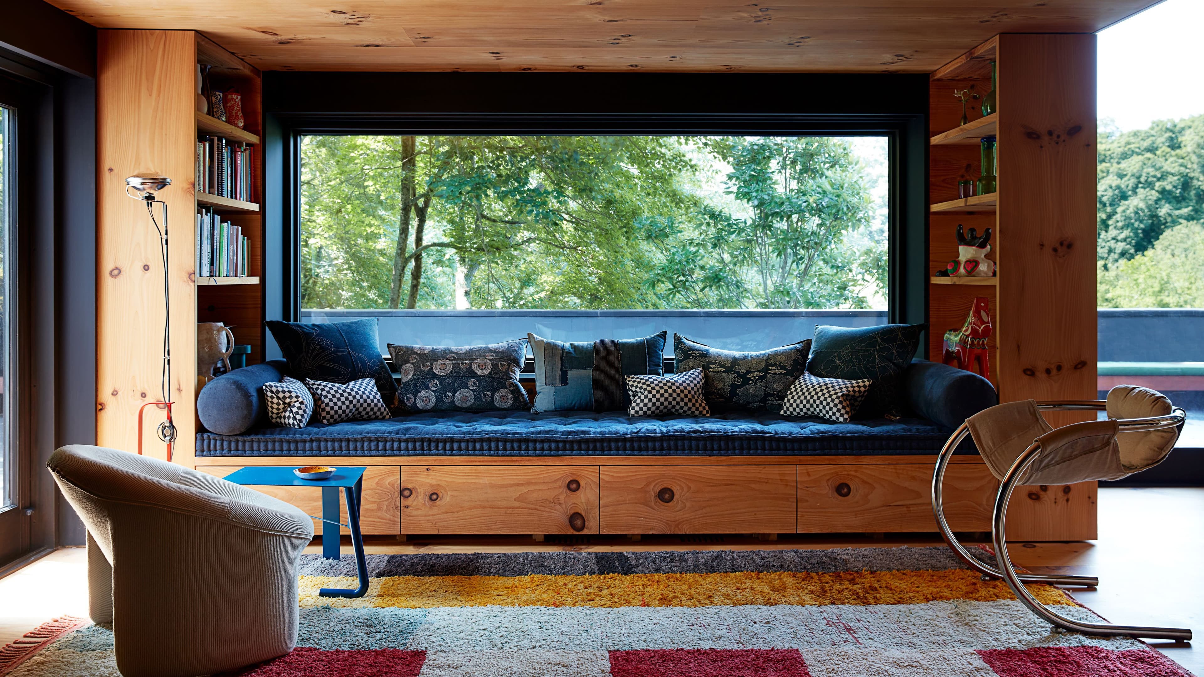 Daybed used as both seating and sleeping surface in a styled bedroom